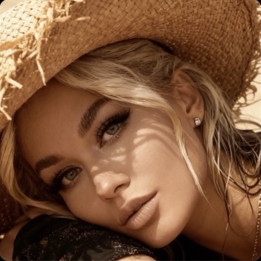 Country Bits playlist cover featuring Nora in a straw hat